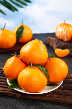 Fresh Mandarin Oranges with Leaves on Wooden Table - Healthy Citrus Fruit Display