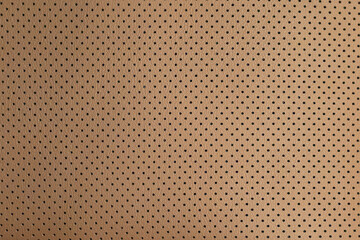 Fototapeta premium Brown perforated leather pattern creating abstract texture background