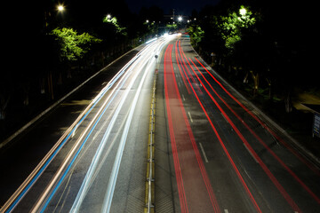 Urban Night Traffic with Red and White Light Trails © KimThi
