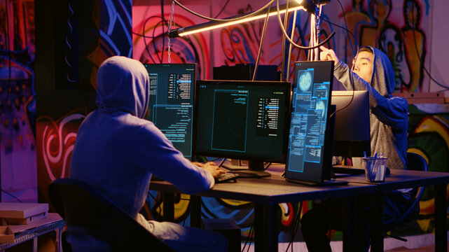 Hackers using network vulnerabilities to exploit servers, doing coordinated cyber attacks, trying to break computer systems at night, Cybercriminals work together on breaching networks.