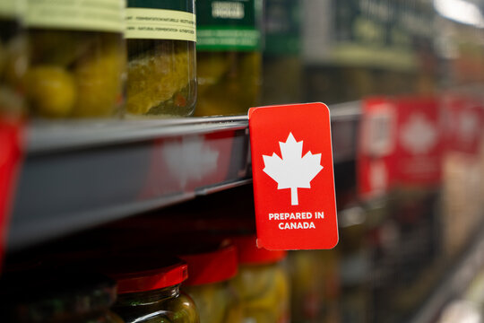 Close up of Prepared in Canada label on grocery shelf.