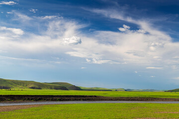 Fototapeta premium Summer scenery of the Molegler River Valley grassland in Hulunbuir League, Inner Mongolia Autonomous Region, China