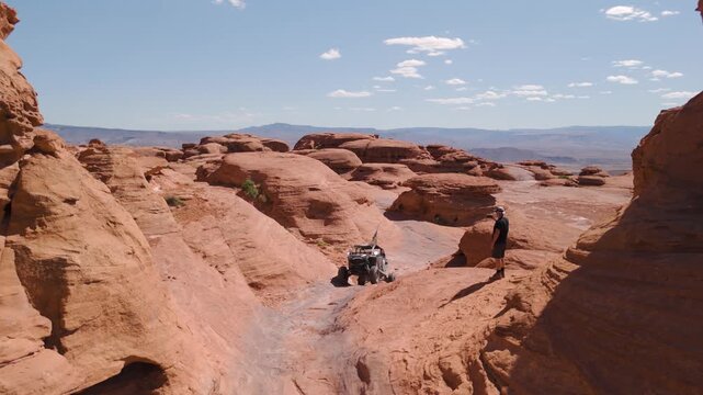 Aerial Drone View of UTVs Offroading on Red Rock Desert Trails in Utah