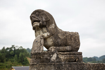 Fototapeta premium Ancient Stone Lion Guardian Statue at Gongguanqiao, Zunyi China