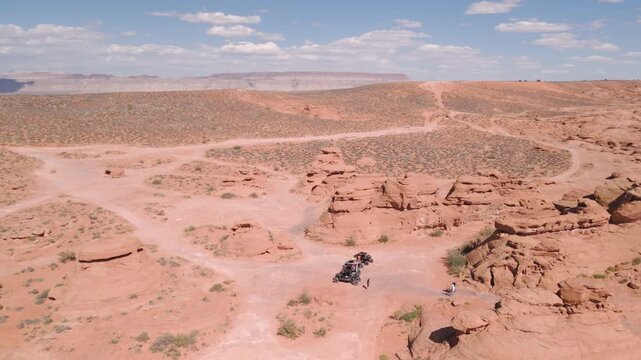 Aerial Drone View of UTVs Offroading on Red Rock Desert Trails in Utah