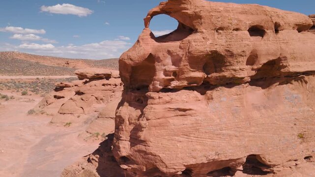 Aerial Drone View Rising Over Utah Desert Bluff with Red Rocks and Sand Dunes