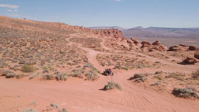 Aerial Drone View of UTVs Offroading on Red Rock Desert Trails in Utah