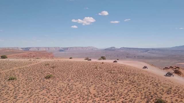 Aerial Drone View of UTVs Speeding Along Open Desert Trails in Utah