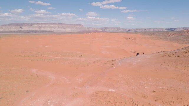 Aerial Drone View of UTVs Speeding Along Open Desert Trails in Utah