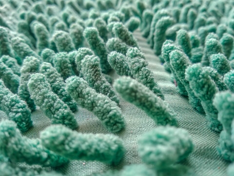 Green microfiber chenille doormat texture full-frame background