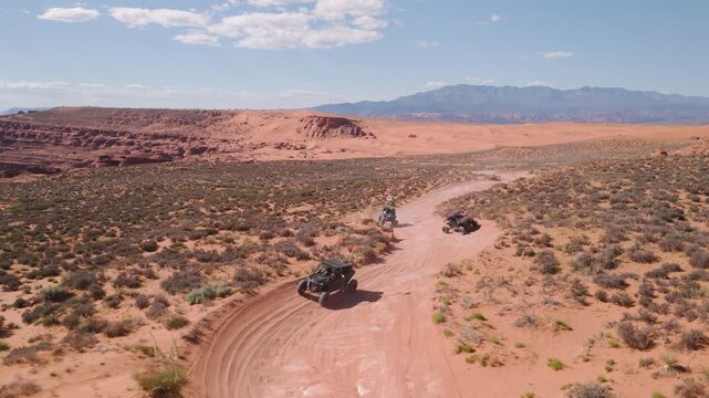 Aerial Drone View of UTVs Speeding Along Open Desert Trails in Utah