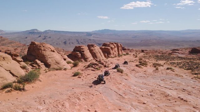 Aerial Drone View of UTVs Offroading on Red Rock Desert Trails in Utah