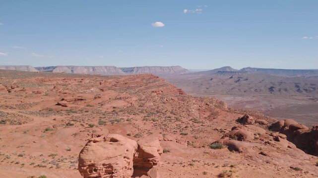 Aerial Drone View Rising Over Utah Desert Bluff with Red Rocks and Sand Dunes