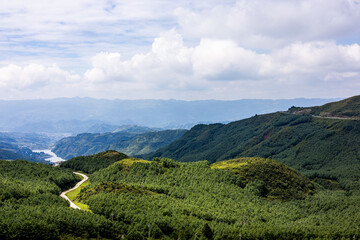 Fototapeta premium Breathtaking Mountain Landscape with Winding Trails and Forest Valley