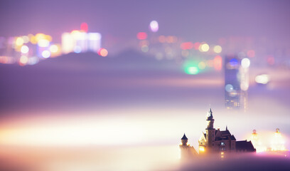 Enchanted Castle in Mist at Night with Bokeh City Lights © LyVan