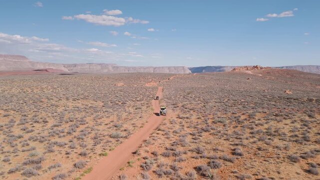 Aerial Drone View of UTVs Speeding Along Open Desert Trails in Utah