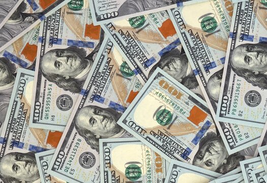 Large amount of banknotes of hundreds of US dollar currency bills. Pile of USA cash