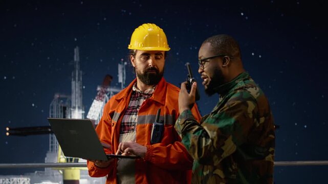 Military man on drilling rig speaks into walkie talkie, enforcing blockade protocol while a soldier on offshore platform talks in handheld radio to receive update on war causing oil crisis.