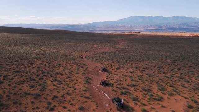 Aerial Drone View of UTVs Speeding Along Open Desert Trails in Utah