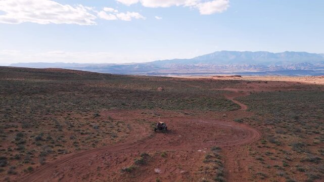 Aerial Drone View of UTVs Speeding Along Open Desert Trails in Utah
