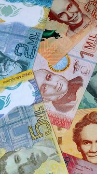 Costa Rican colon money bills in pile on table. Costa Rica CRC currency cash close up