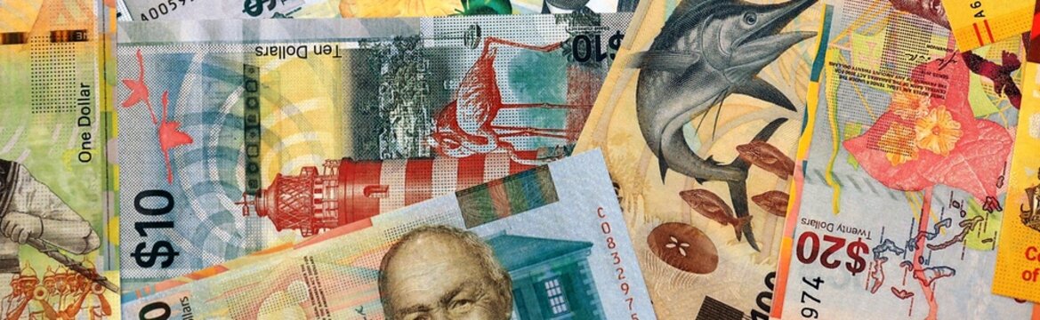 Bahamian dollar money bills in pile on table. Bahamas BSD currency cash close up