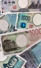 Japanese yen money bills in pile. Big amount of Japan JPY currency cash close up © Viktor