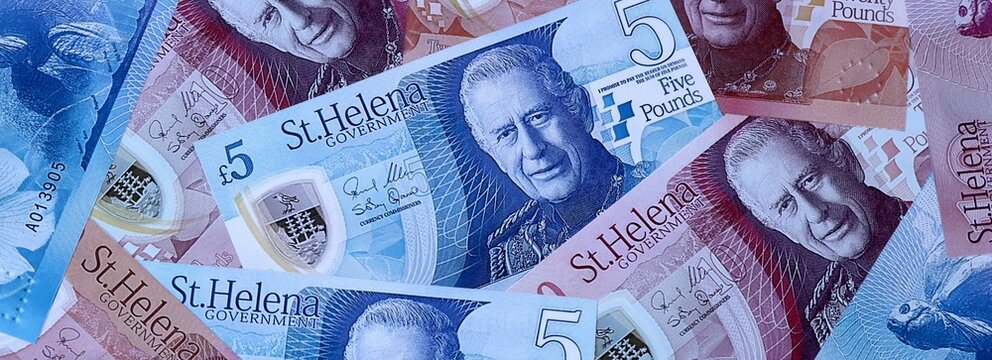 Saint Helena pound money bills in pile. Big amount of Saint Helena SHP currency cash close up