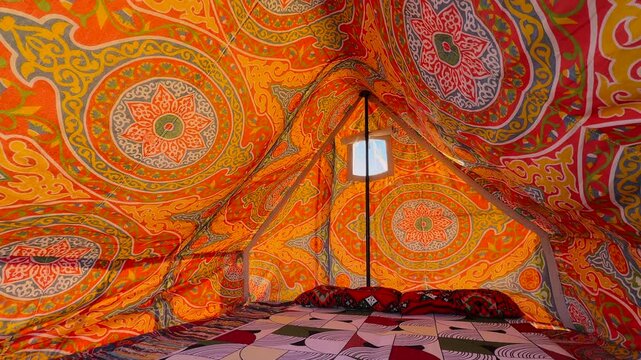 Interior View of Colorful Ornamental Arabic Bedouin Tent with Patterned Fabric Ceiling and Carpet in Sinai Egypt