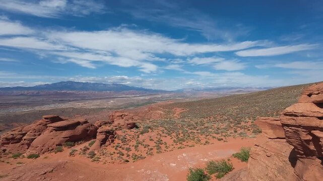 FPV Drone Cinematic Flight Around Desert Rock Pillars with UTVs and People Camping