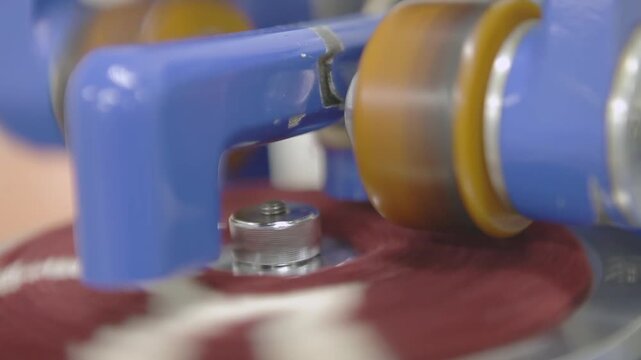 Close-up of Red Carpet Fabric Abrasion Testing Machine Operating in Laboratory