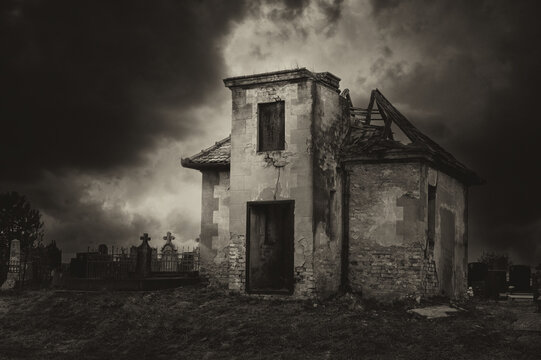 Dark creepy cemetery on a cloudy autumn day