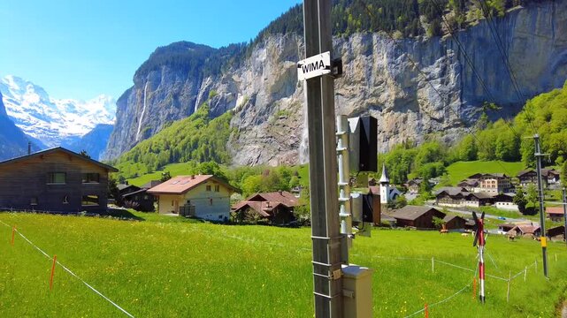 Landscape of Lauterbrunnen village, the Staubbach Fall and the Lauterbrunnen Wall in Swiss Alps, Switzerland.