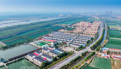 Fototapeta premium Aerial View of Siyi Village New Residential Development and Rural Landscape