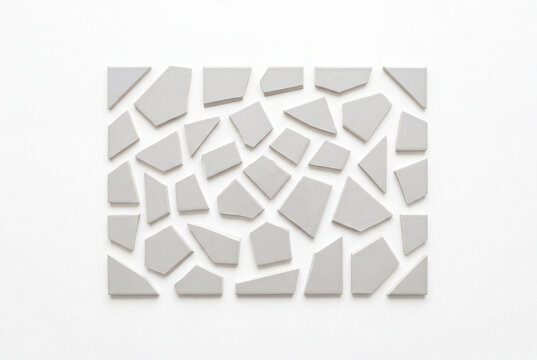 Geometric pattern of light gray ceramic tile pieces