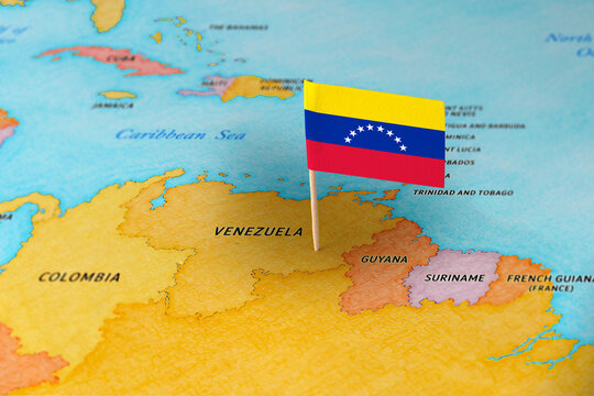 Venezuela flag pin marking Venezuela on South America map, travel destination concept