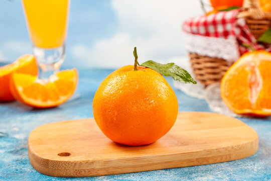 Fresh Orange with Diced Segments and Juice at Beach Picnic