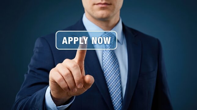 Businessman in suit points to apply now button on screen