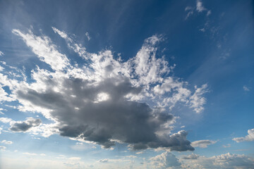 Fototapeta premium Dramatic cumulus cloud formation over bright blue sky