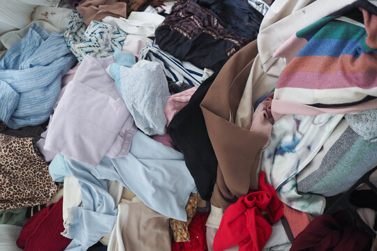 Clothes piled on a surface at a sorting location