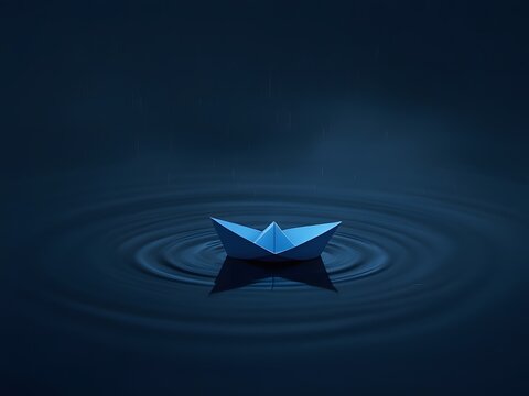 Blue origami boat floats on rippling water surface
