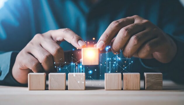 Person placing glowing wooden block, connecting it to other blocks. Business concept