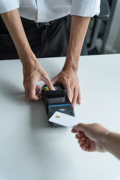 Man hands using credit card payment cashless technology