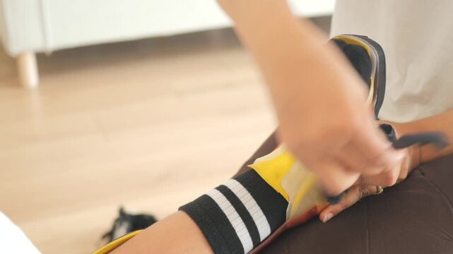 Child receives ankle support in therapy session