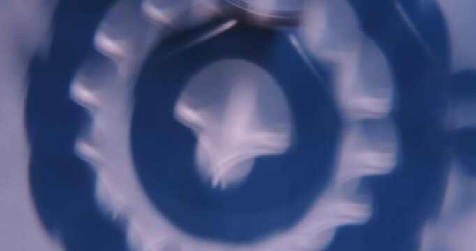 Defocused light. Crystal flare. Blur blue white color kaleidoscope optical flicker leaking on abstract illuminated visual background.