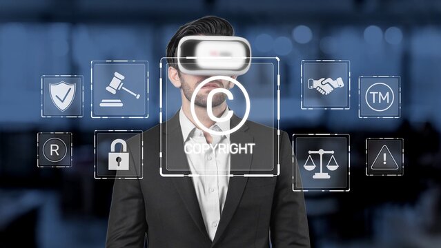 A businessman wearing a virtual reality headset in a modern office is surrounded by digital icons representing copyright and legal concepts, showcasing innovation in commerce. Raster
