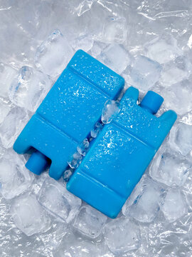Two blue reusable ice packs for cooler box