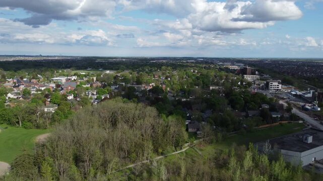 Aerial view of Milton, Ontario, Canada as shot from a drone on a mixed sunshine and clouds spring day in May, 2022. Flying south towards Main Street parallel to Bronte.
