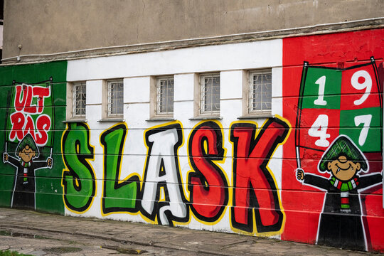 Wroclaw, Poland - June 06, 2026: Slask Wroclaw football fans mural featuring large club name, Ultras text and 1947 founding year painted on a wall
