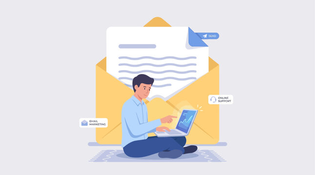 Man sitting cross-legged on floor with laptop and large envelope